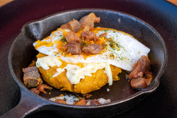 Gourmet Ecuadorian green plantain tortilla with pork cracklings and fried egg © Yessstockphoto