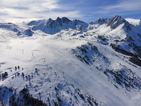 Aerial view of a snow-covered ski resort with mountains in the background, Grau Roig, Encamp, Andorra, Pyrenees