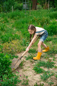 Little girl working in the garden