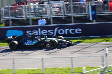 Obraz premium May 24, 2026, Montreal, Canada, Mercedes F1 car racing through Circuit Gilles Villeneuve corner. g.