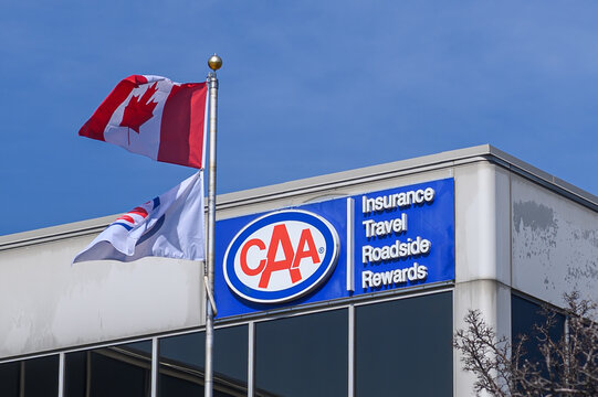 CAA company logos and flags on building in Toronto