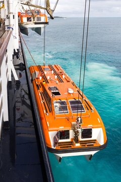 Tender being lowered on cruise ship