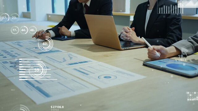 A group of male and female business professionals in a meeting and the concept of financial technology.