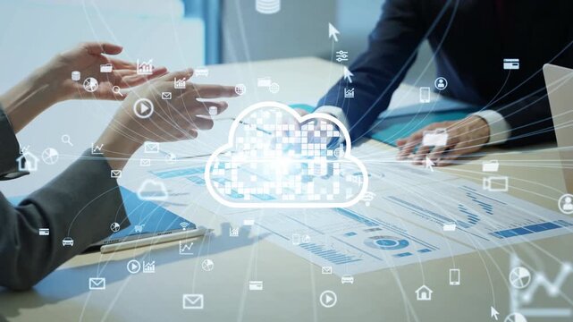 A group of male and female business professionals holding a meeting and the concept of a cloud network.