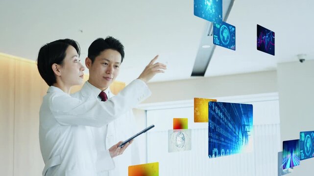 立体映像を見る男女研究者のグループ
