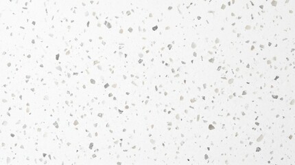 Naklejka premium Bright and smooth white surface adorned with a random scattering of small, dark particles, creating a sophisticated and clean textured background for diverse design