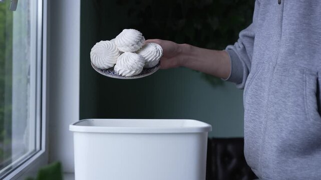 Man composting leftover dessert, sustainable lifestyle