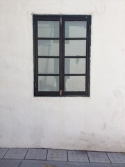 Obraz premium black framed window on white textured wall