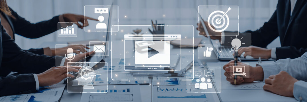 Business professionals engage in a collaborative meeting using digital tools and analytics to develop a marketing strategy, focusing on modern communication and growth. Trope