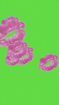 kiss icons floating towards the screen, green screen background