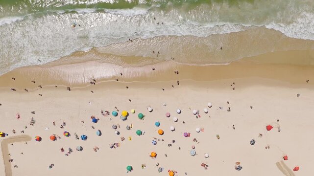 Aerial view of Copacabana beach with colorful umbrellas and people in summer, Rio de Janeiro, Brazil