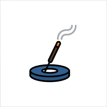 Cigarette in an ashtray burning slowly.