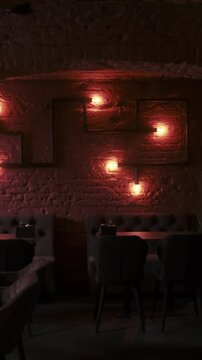 Vertical video. Hookah lounge. Shisha bar. Empty modern cafe interior with chairs tables in professional relaxing pub workspace.