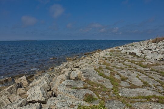 Rocky shoreline of Elda Pank (Elda cliff) in sunny summer weathe, Saaremaa, Estonia, Europe.