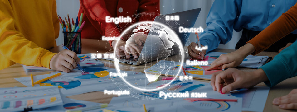 A diverse group of individuals collaborates on a language project, analyzing charts and notes around a desk, emphasizing global communication and teamwork. Trope