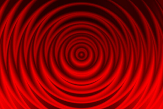 Abstract red background with concentric circular ripple or wave pattern