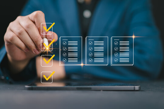 Business performance checklist and tracking concept with businessman using laptop and tablet, representing digital inspections, online surveys, assessment questionnaires, and workflow evaluation.