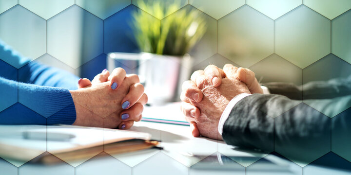 Business negotiation between businesswoman and businessman, light effect, geometric pattern