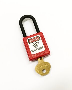 Master Lock Safety Locked Out Padlock with a key on white background. Padlock is designed exclusively for lockout tagout applications and is best used as part of a comprehensive OSHA compliant safety 