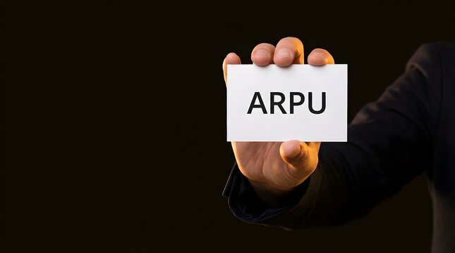 Business professional holding a white card with arpu text concept for average revenue per user metrics