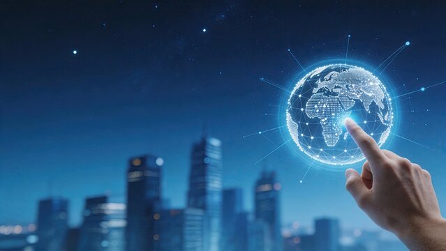 Human hand touching a glowing digital globe composed of connected dots and lines hovering above a blurred city skyline at night illustrating concepts of global connectivity,