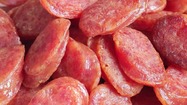 Closeup fried sliced kun chiang sausage on white