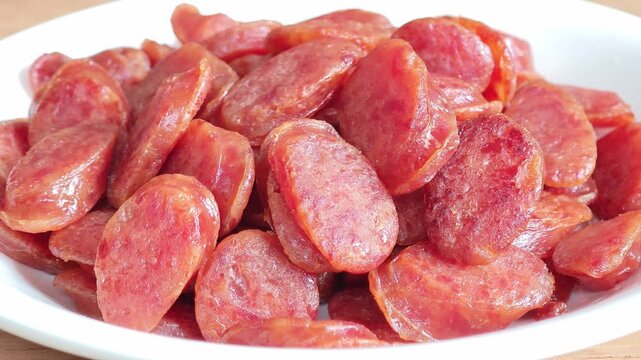 Closeup fried sliced kun chiang sausage on white