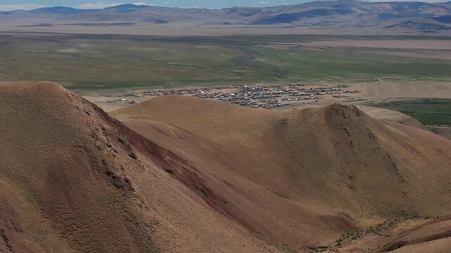 Red clay canyon. Aerial video from drone of Altai mountain landscape. Camera moves backwards with zoom effect.