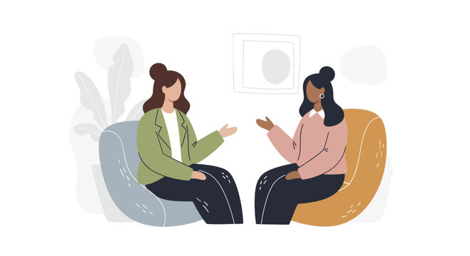 Two women engaged in conversation sitting in chairs.