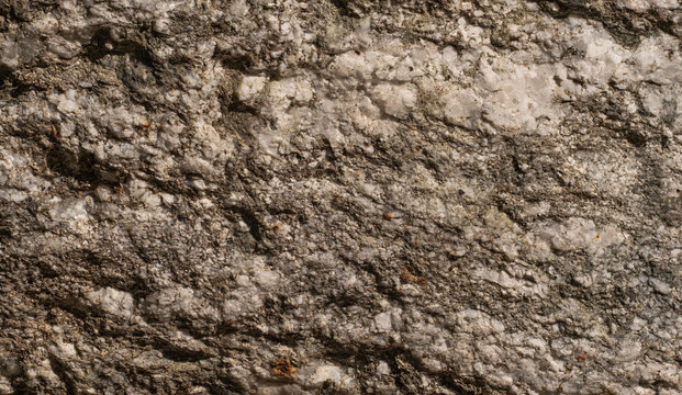 Ultra sharp macro of premium grey granite stone, High-Focus Texture of seamless rugged mineral rock background