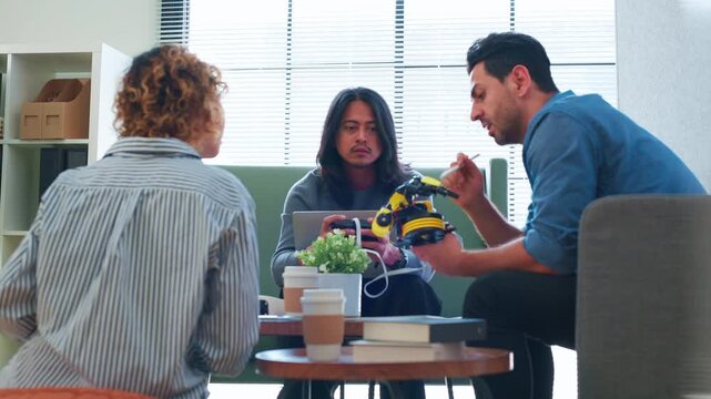 Professional Engineer Holding Microcontroller Circuit Board Explaining Robotics Project to Tech Startup Team Portrait of Computer Scientist Indoor