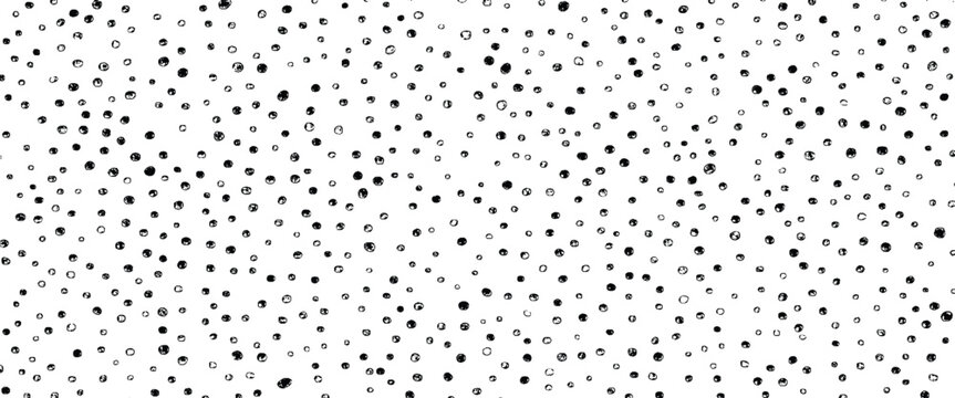 Black hand drawn dots scattered across a white background pattern random irregular
