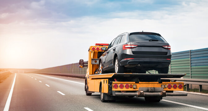 Roadside assistance truck providing emergency towing service