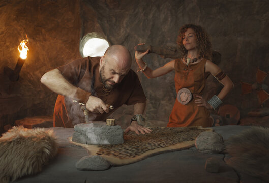 Prehistoric family and gender roles: confident bossy wife and submissive man doing chores