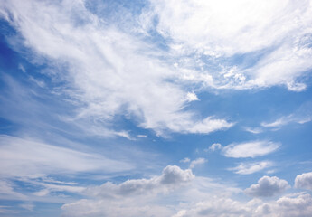Naklejka premium clear blue sky background,clouds with background, Blue sky background with tiny clouds. White fluffy clouds in the blue sky. 