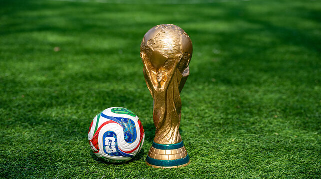 May 7, 2026, United States. The trophy of the 2026 FIFA World Cup and the official Adidas Trionda ball on the green lawn of the stadium.