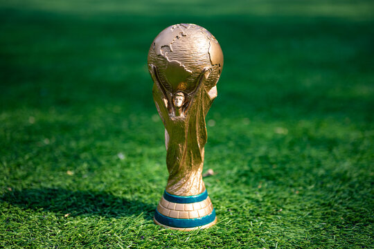 May 7, 2026, United States. The trophy of the 2026 FIFA World Cup on the green lawn of the stadium.