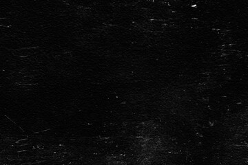 Fototapeta premium Old black stucco wall with white scratches and scuffs texture. textured grunge black board with chalk