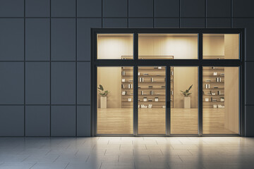 Modern exterior view of illuminated library interior with bookshelves seen through large windows at night from empty city street facade design building exterior view. 3D Rendering © Who is Danny