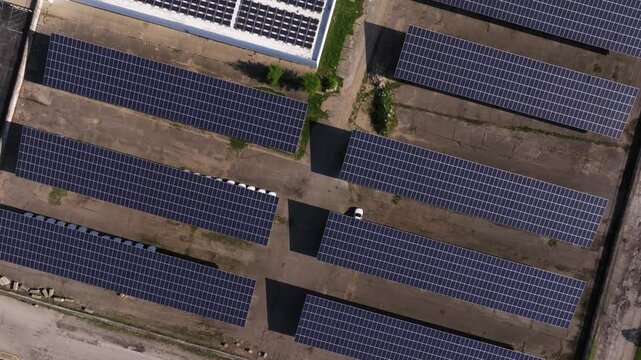 Solar panel arrays and rooftop mounted pieces at large scale data center, drone