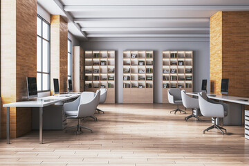 Modern open loft office interior with rows of desks, computers, brick walls, wooden floor, bookshelves and bright contemporary workspace design. 3D Rendering © Who is Danny
