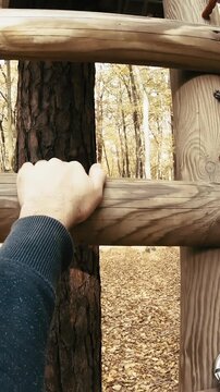 Person POV climb the ladder in adventure park