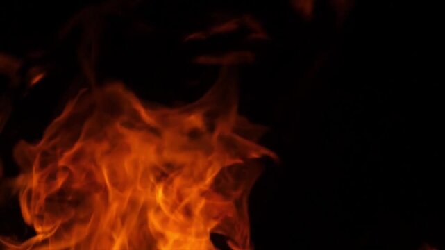 Realistic fire flames burning on black background, close up roaring blaze animation for cinematic video editing VFX overlay elements, 4k loop video