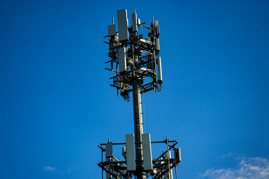 Cell tower. Cellular telecommunications tower. Telecom mobile network. Wireless communication network. Mobile infrastructure. antenna array. Antenna panel. Radio telecom antenna. Base station.