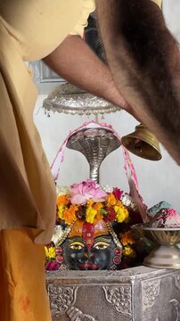 4k clip of Shivling or shiv lingam decorated with colours and flowers to worship lord shiv. Selective focus.