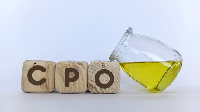 CPO or Crude Palm Oil in wooden cubes. Industrial and food concepts