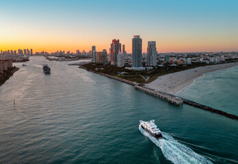 Fototapeta premium Miami pier with south pointe at night. Miami ocean shore at night. Miami shoreline. Panoramic Miami evening coastline.