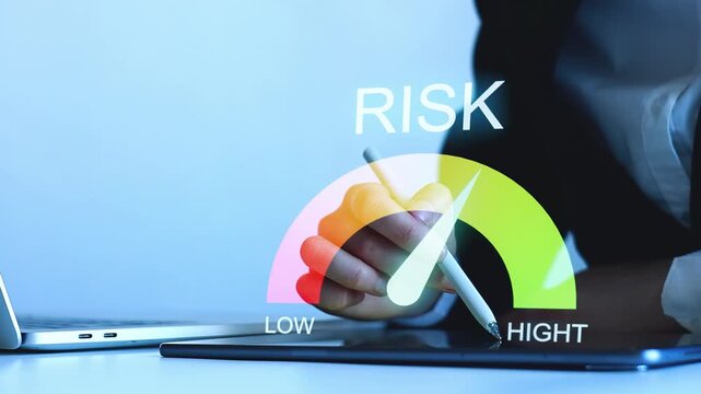 Understanding risk levels in finance using a digital display during a business meeting in an office.