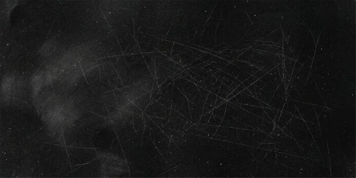 A close-up view of a dark, dusty surface with prominent scratch marks and smudges, conveying a sense of age and wear.