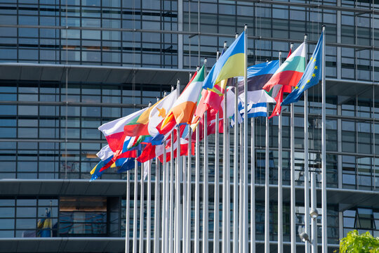 European Parliament building and flags in Strasbourg city, France, legislative council body of EU, flags of european union countries, politics, administration and economy